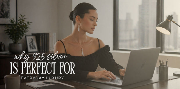 A woman sitting at a desk, working on a laptop, wearing 925 sterling silver jewelry. The image highlights the elegance and versatility of sterling silver jewelry for everyday luxury.