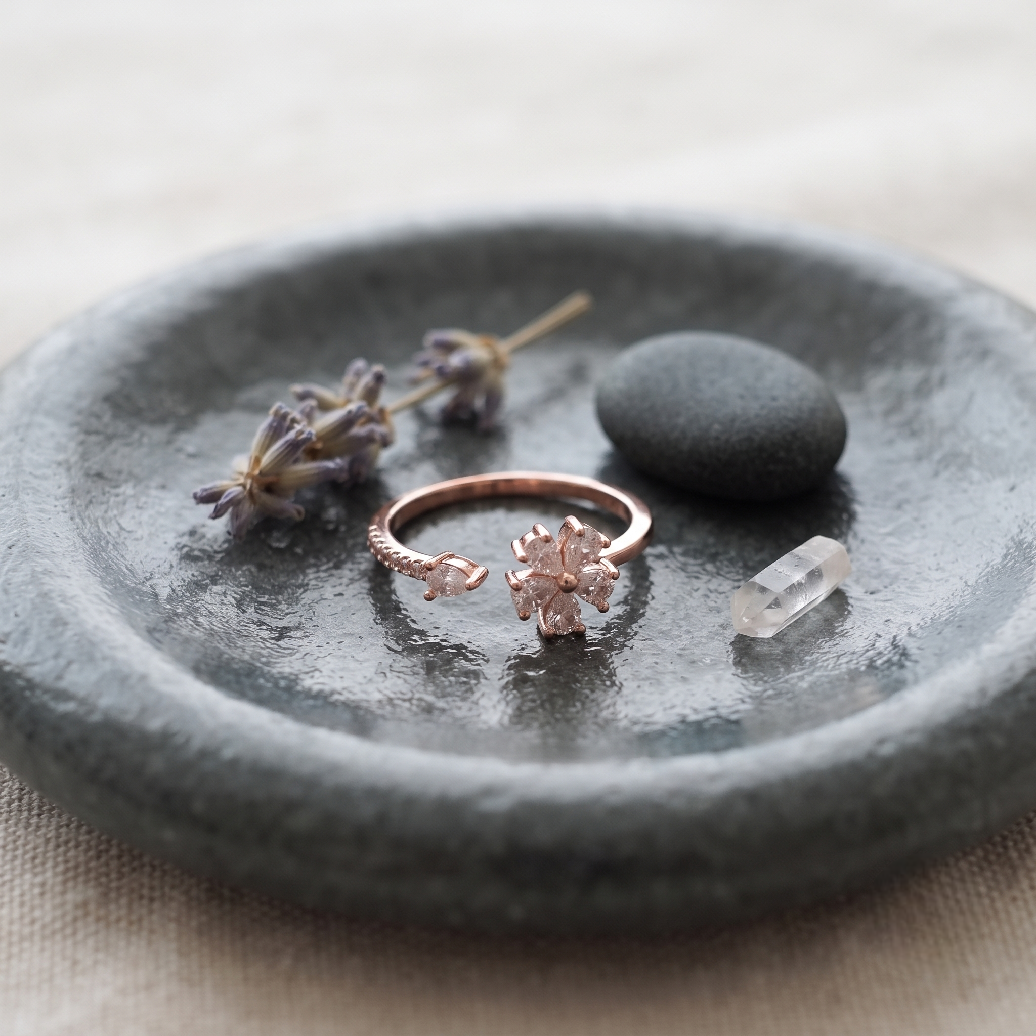 925 Sterling Silver Rose Gold Floral Open Ring with Clear CZ Stones on Gray Slate Surface.