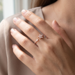 925 Sterling Silver Rose Gold Floral Open Ring with Clear CZ Stones on Gray Slate Surface.