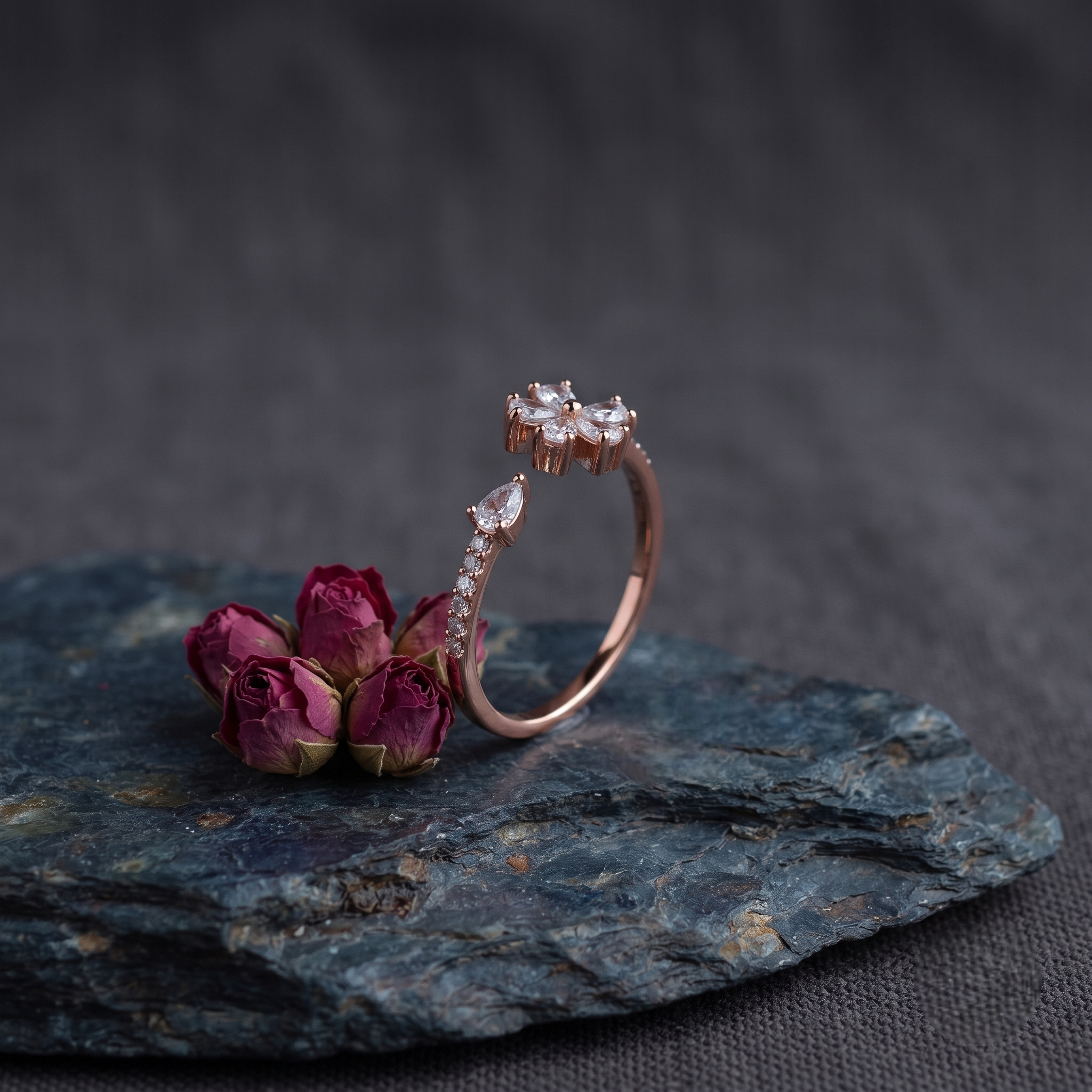 925 Sterling Silver Rose Gold Floral Open Ring with Clear CZ Stones on Gray Slate Surface.