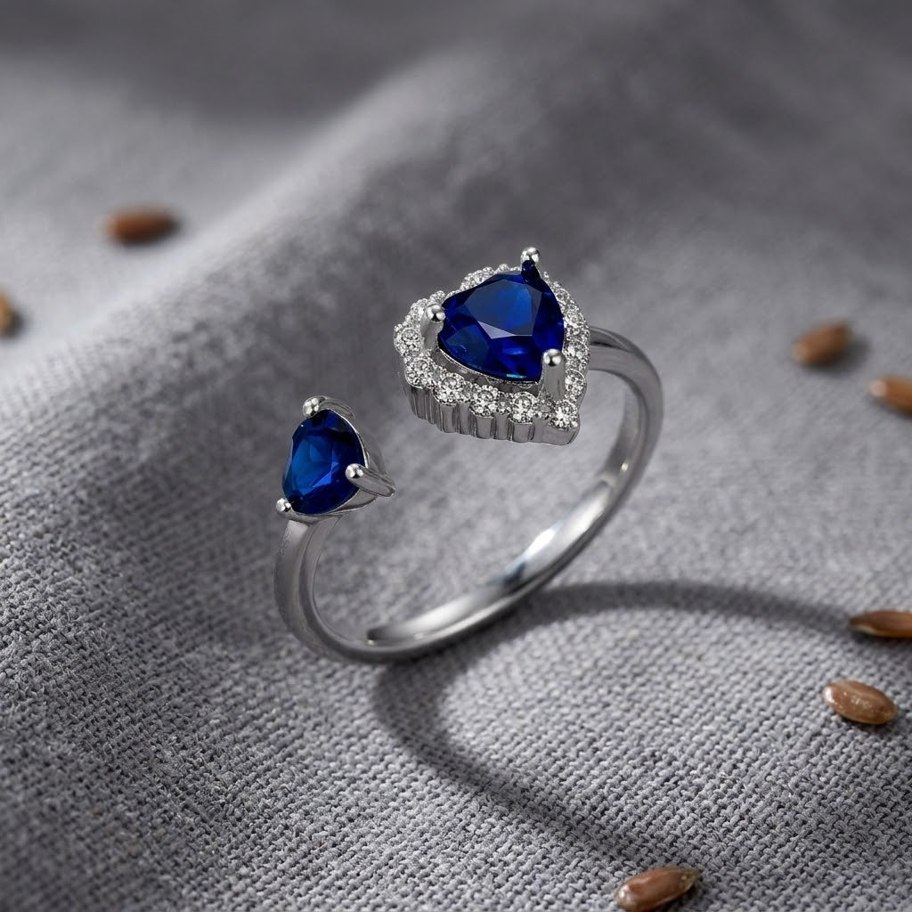 925 Sterling Silver Open Heart Ring with Blue CZ and Clear Halo Accent.
