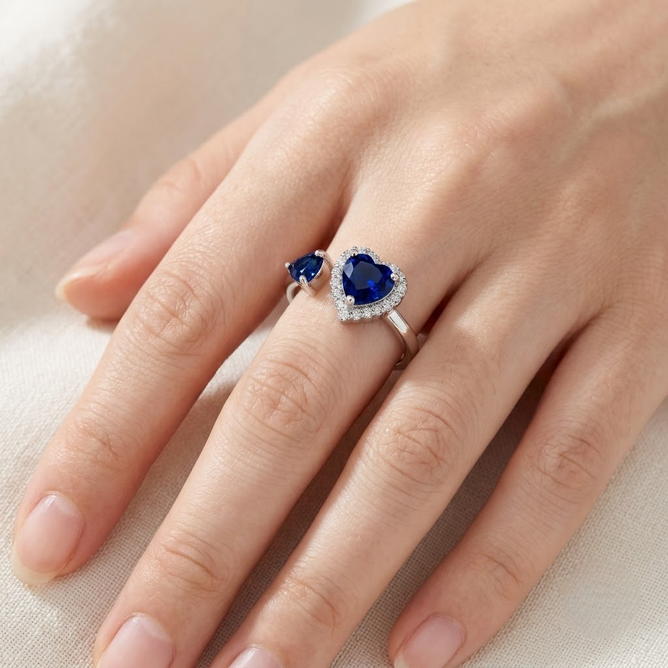 925 Sterling Silver Open Heart Ring with Blue CZ and Clear Halo Accent.