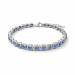 Silver bracelet with blue gemstones on a white background