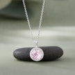 Necklace with a pink gemstone pendant 