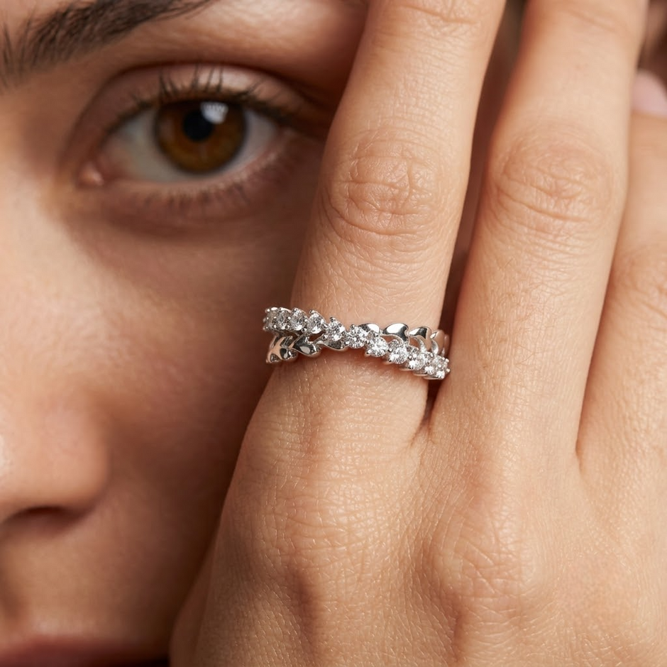 25 Sterling Silver Floral Heart Eternity Ring with Clear Cubic Zirconia Stones on a Black Slate Display.