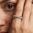 25 Sterling Silver Floral Heart Eternity Ring with Clear Cubic Zirconia Stones on a Black Slate Display.