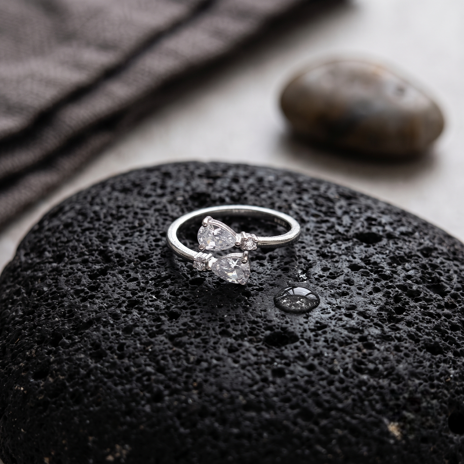 925 Sterling Silver Pear Cut CZ Open Ring with Round Accent Stones.