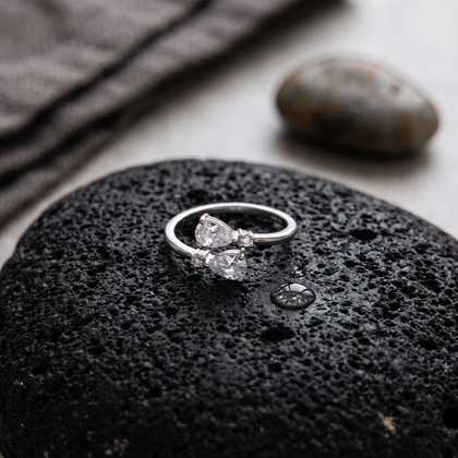925 Sterling Silver Pear Cut CZ Open Ring with Round Accent Stones.