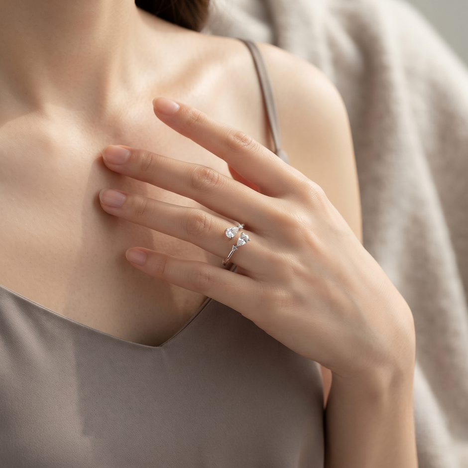 925 Sterling Silver Pear Cut CZ Open Ring with Round Accent Stones.
