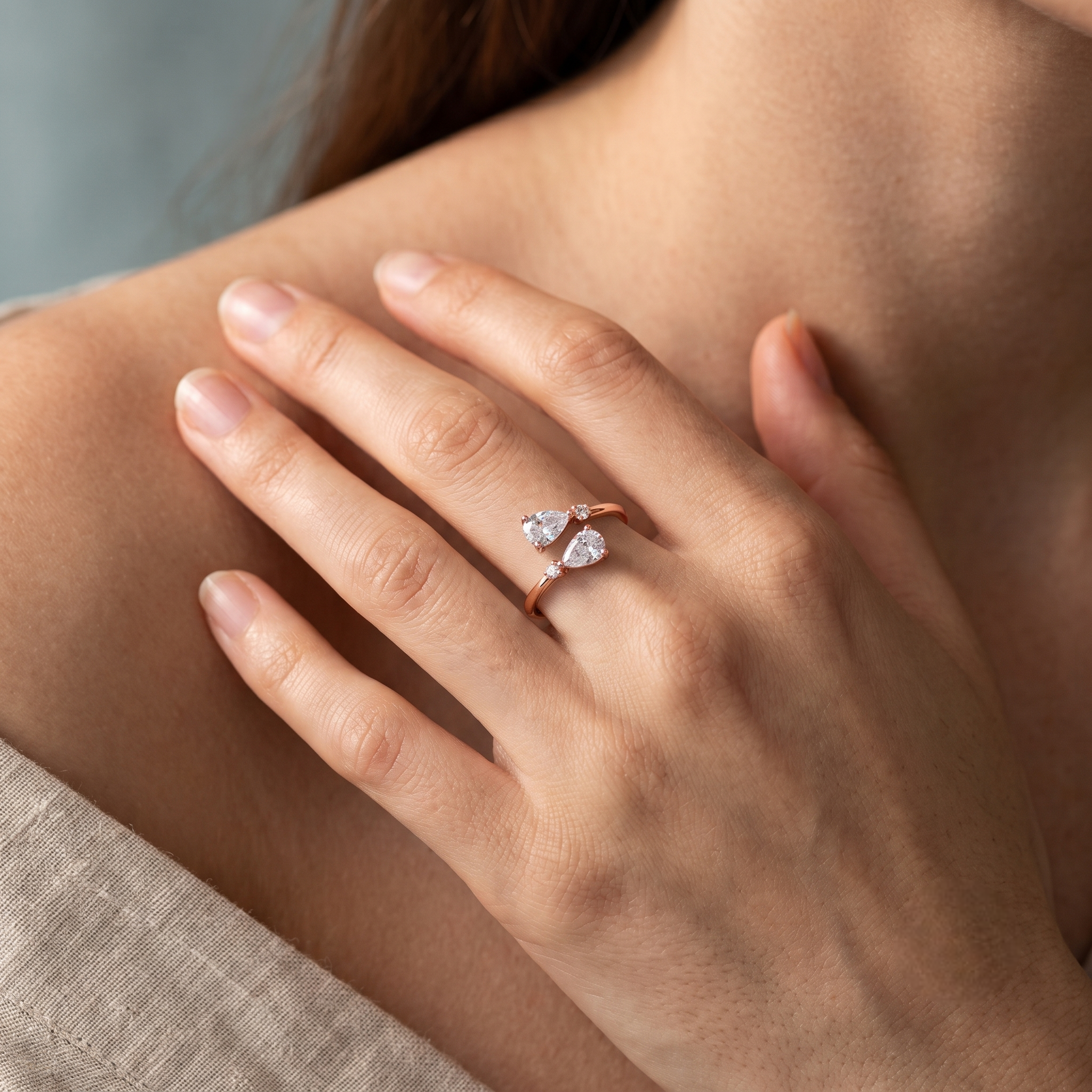 925 Sterling Silver Rose Gold Open Ring with Dual Pear Cut CZ Stones and Round Accents on Natural Stone.