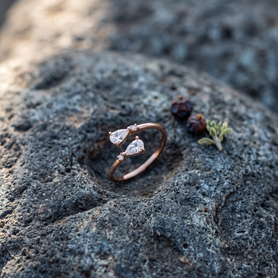 925 Sterling Silver Rose Gold Open Ring with Dual Pear Cut CZ Stones and Round Accents on Natural Stone.