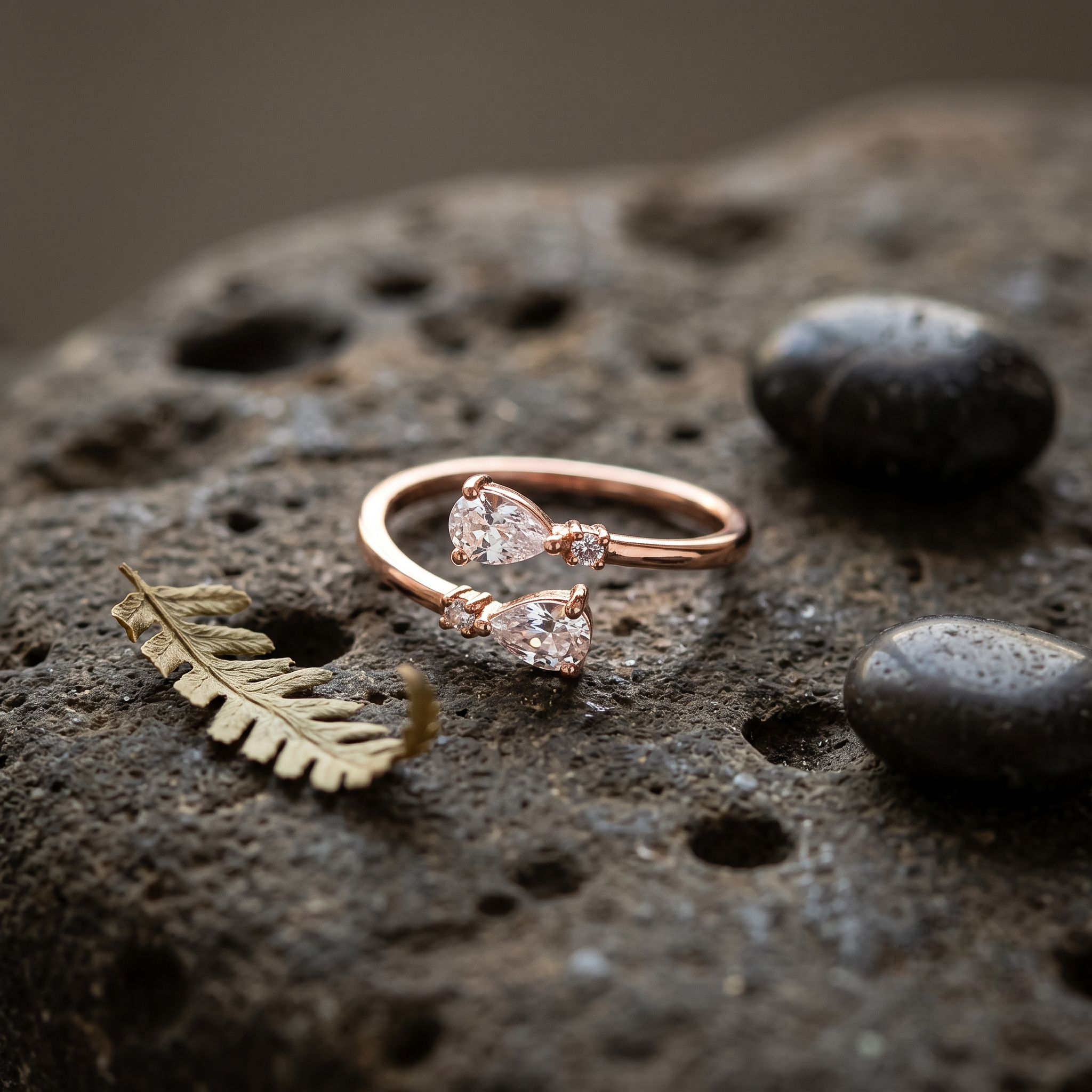 925 Sterling Silver Rose Gold Open Ring with Dual Pear Cut CZ Stones and Round Accents on Natural Stone.