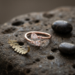 925 Sterling Silver Rose Gold Open Ring with Dual Pear Cut CZ Stones and Round Accents on Natural Stone.