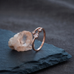 925 Sterling Silver Rose Gold Open Pear CZ Ring on Black Slate.