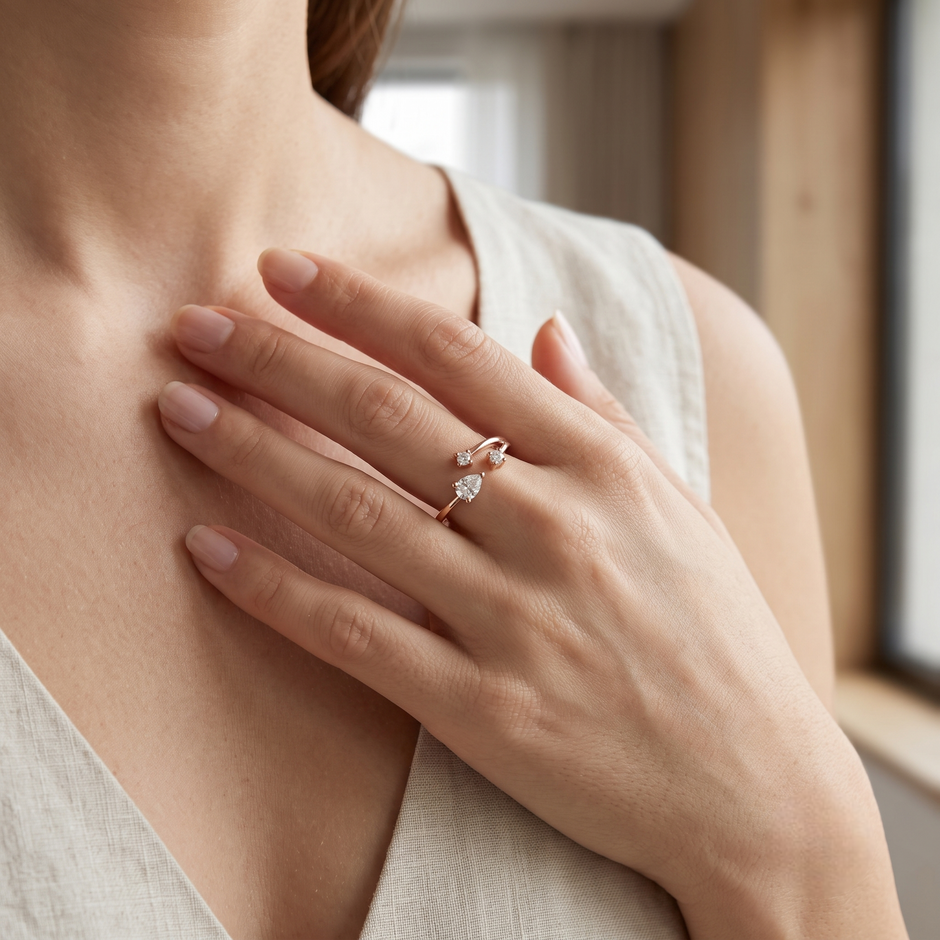 925 Sterling Silver Rose Gold Open Pear CZ Ring on Black Slate.