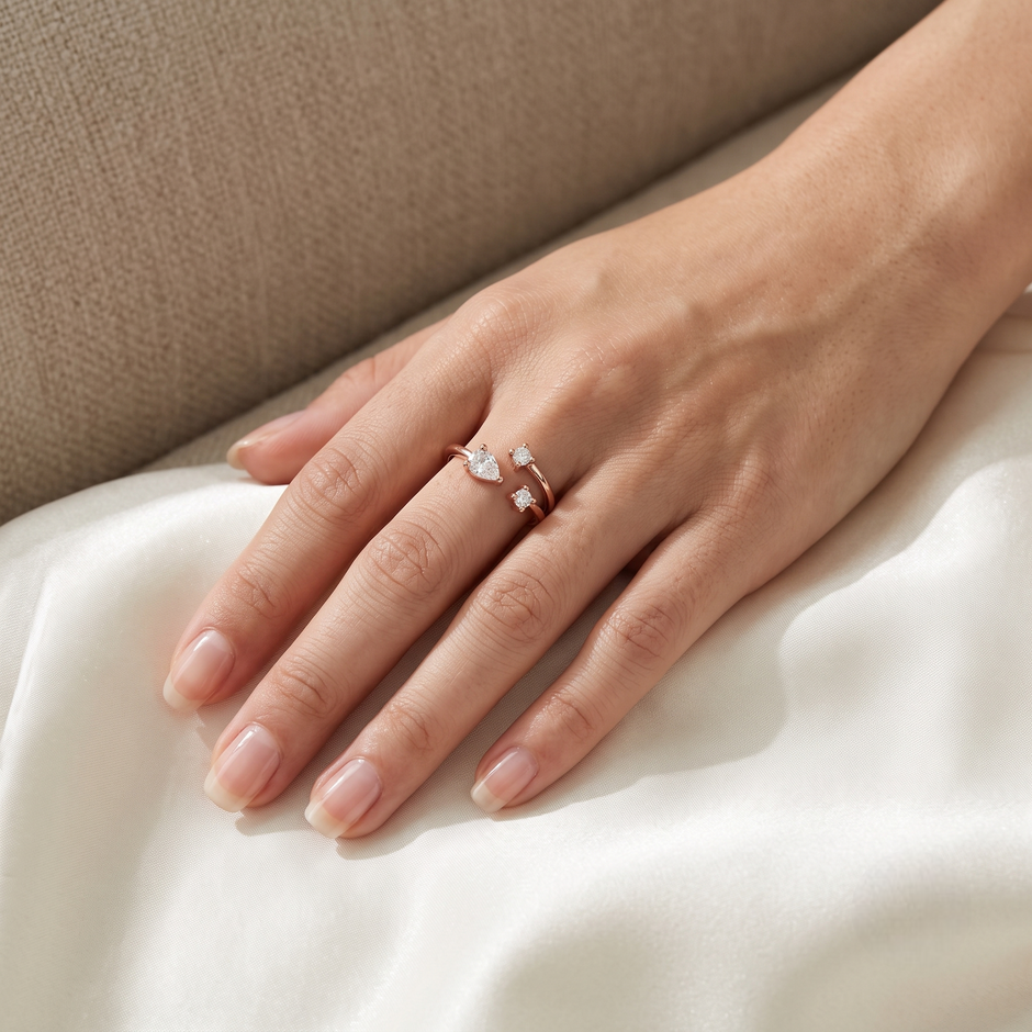 925 Sterling Silver Rose Gold Open Pear CZ Ring on Black Slate.
