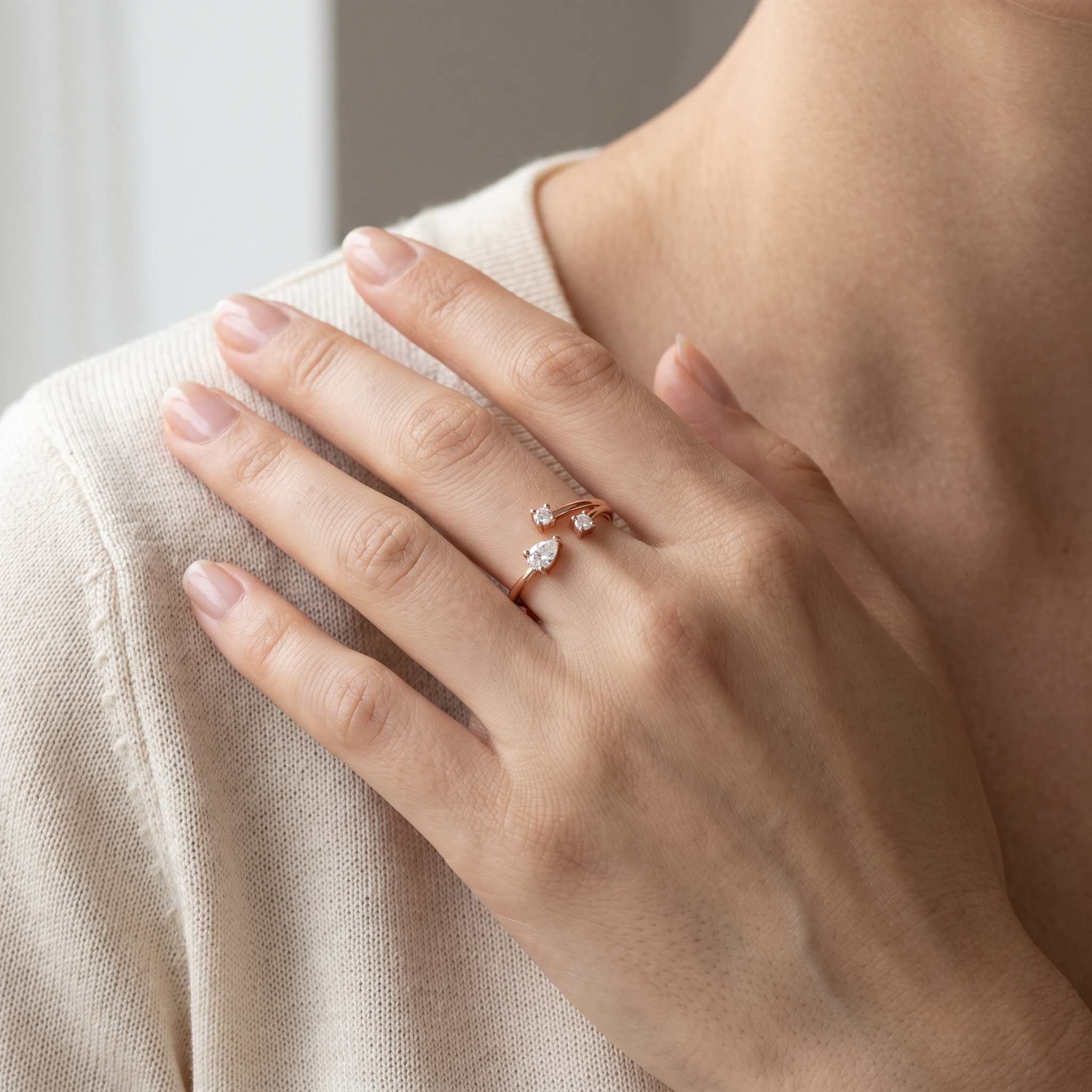 925 Sterling Silver Rose Gold Open Pear CZ Ring on Black Slate.
