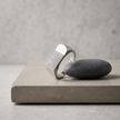 Silver ring with a rectangular pavé-set face and wide polished band.