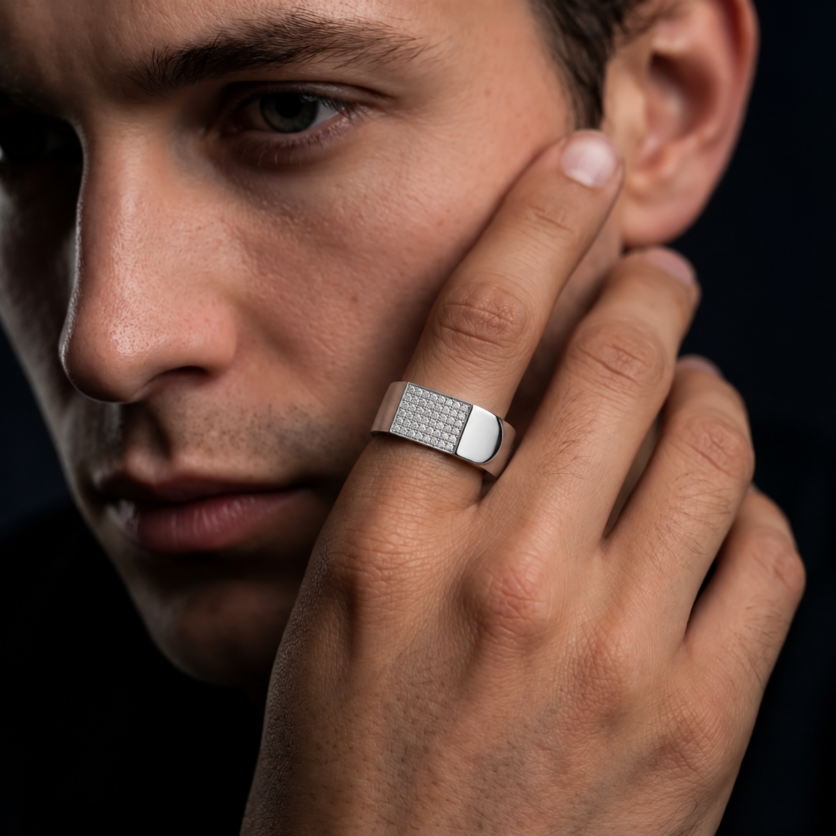Silver ring with a rectangular pavé-set face and wide polished band.