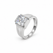 Silver ring with a large rectangular clear stone and engraved geometric band.