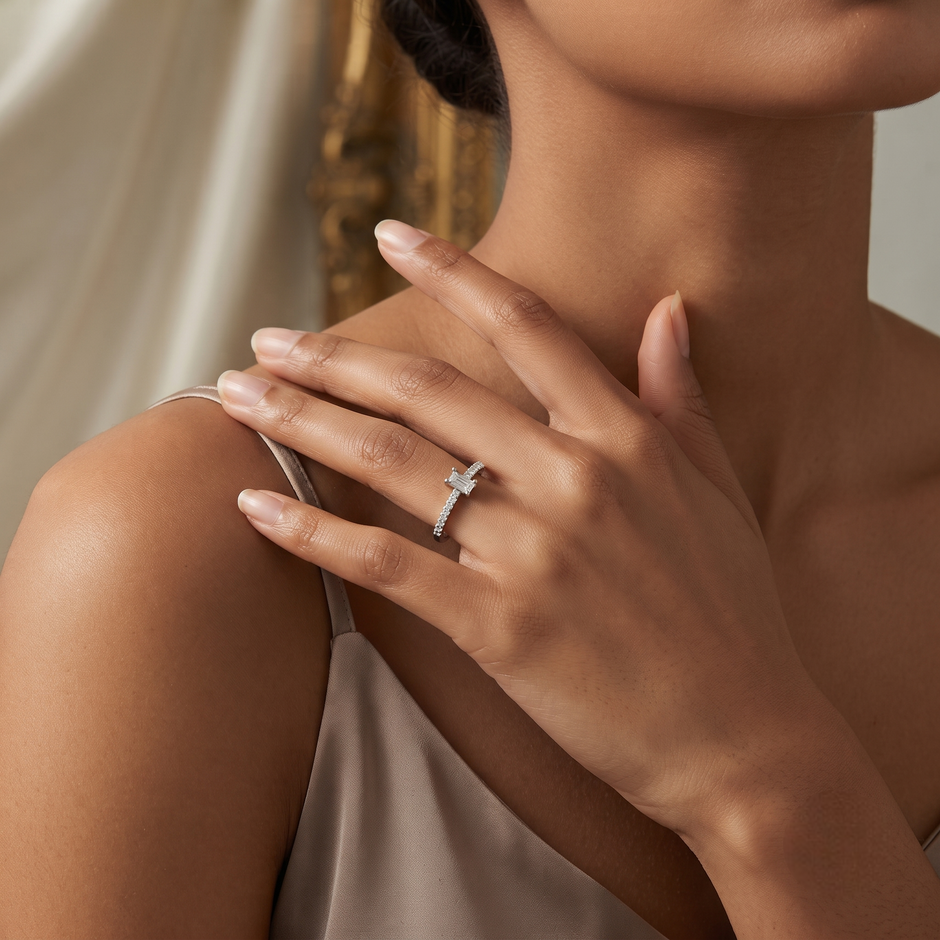 925 Sterling Silver Emerald Cut Solitaire CZ Ring with Pavé Band on Black Stone Display