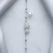 925 Sterling Silver Bracelet with Double CZ Heart Charms, Pearl Drop, and Beaded Chain on White Background