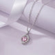 Necklace with a pink gemstone pendant on a soft purple background