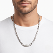 Silver paperclip chain with an oval stone-studded centrepiece 