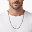 Silver chain with alternating polished cylindrical links and stone-studded barrel accents.