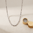 Silver rectangular-link chain with sparkling stone-set accents.
