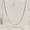 Silver rectangular-link chain with sparkling stone-set accents.