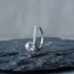 925 Sterling Silver Pavé CZ Band Ring on Blue Slate Surface