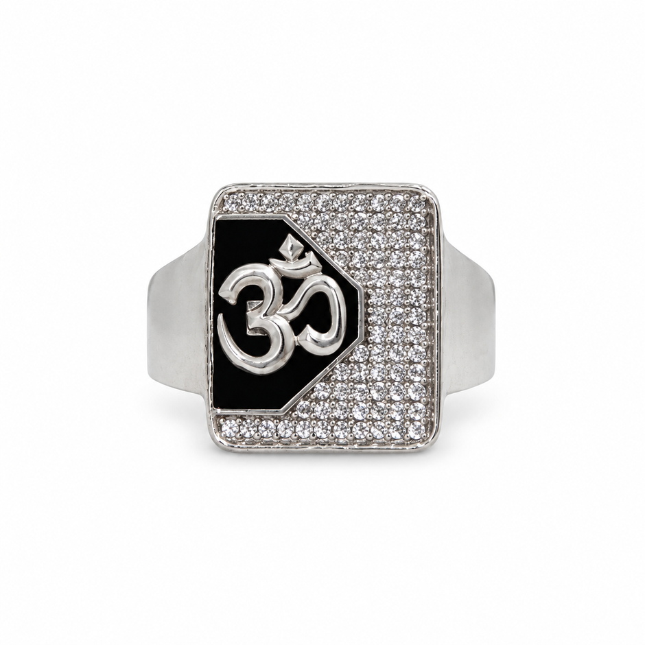 Silver ring with an Om symbol on a black centre and square stone-studded border.