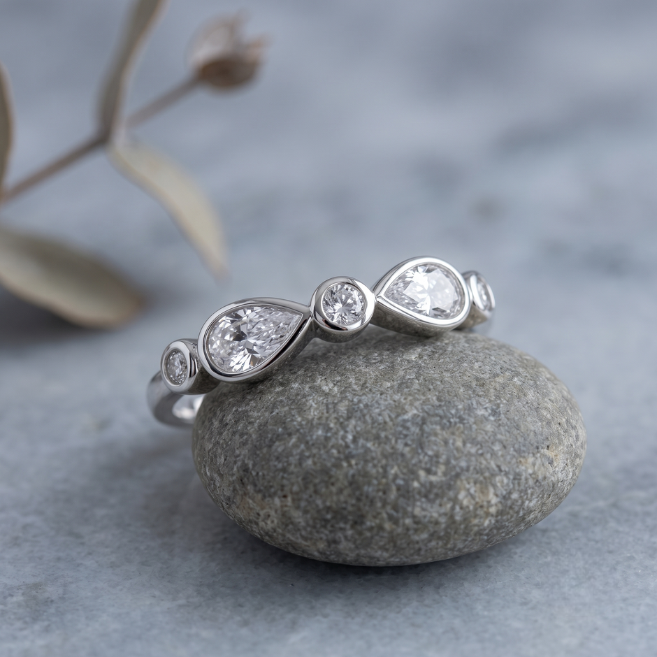 925 Sterling Silver Bezel-Set Pear and Round CZ Band Ring.