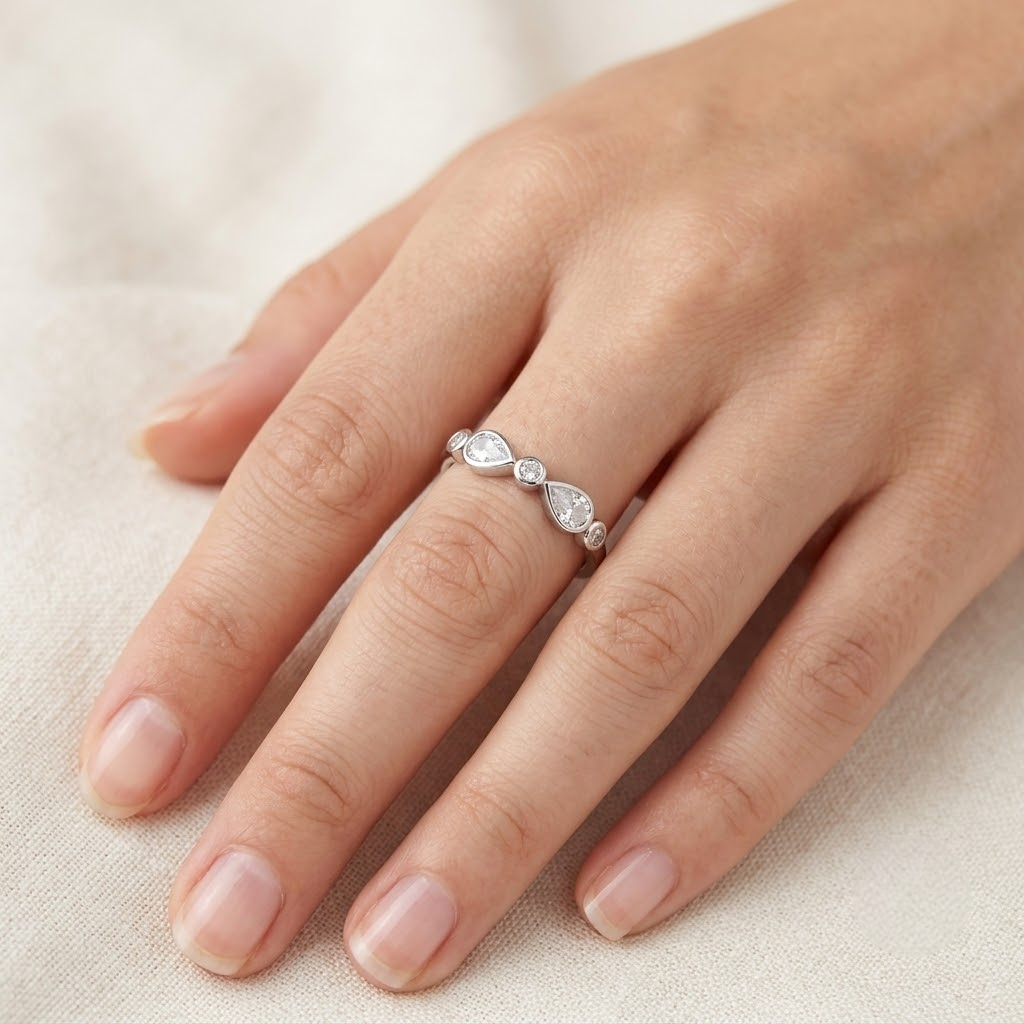 925 Sterling Silver Bezel-Set Pear and Round CZ Band Ring.