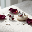 925 Sterling Silver Red & White CZ Butterfly Stud Earrings for Women on Soft Floral Background