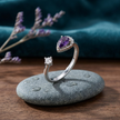 925 Sterling Silver Open Ring with Purple Pear-Cut CZ and Clear Round CZ.