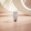 Silver ring with a square pavé-set face and open slotted band.