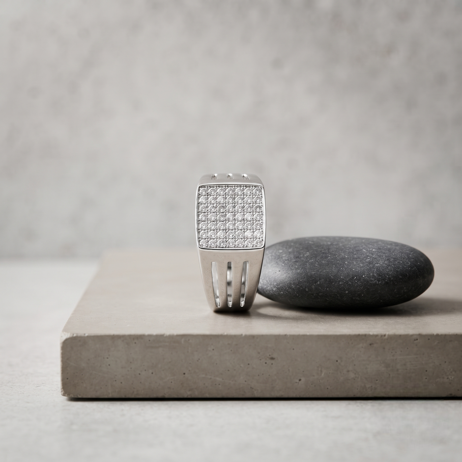 Silver ring with a square pavé-set face and open slotted band.