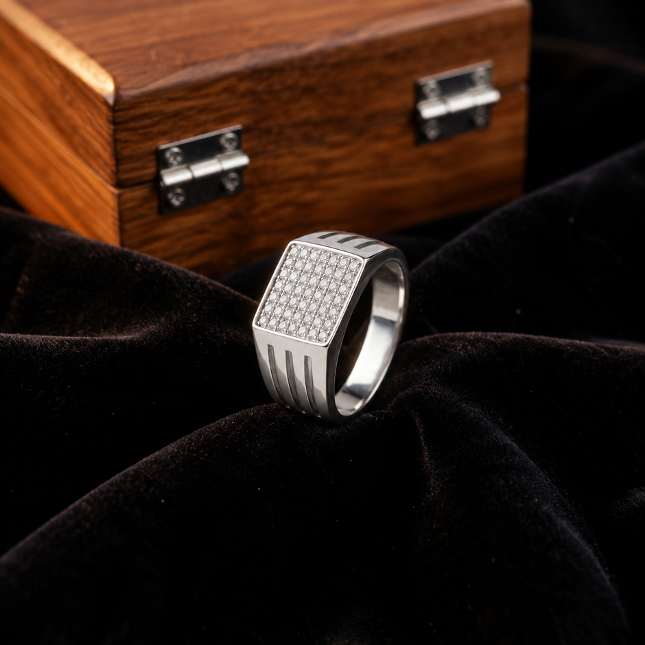 Silver ring with a square pavé-set face and open slotted band.