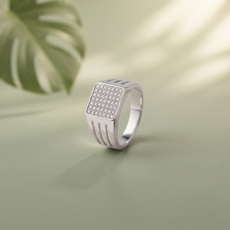 Silver ring with a square pavé-set face and open slotted band.