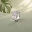 Silver ring with a square pavé-set face and open slotted band.