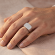 Silver ring with a broad rectangular pavé-set face and polished band.
