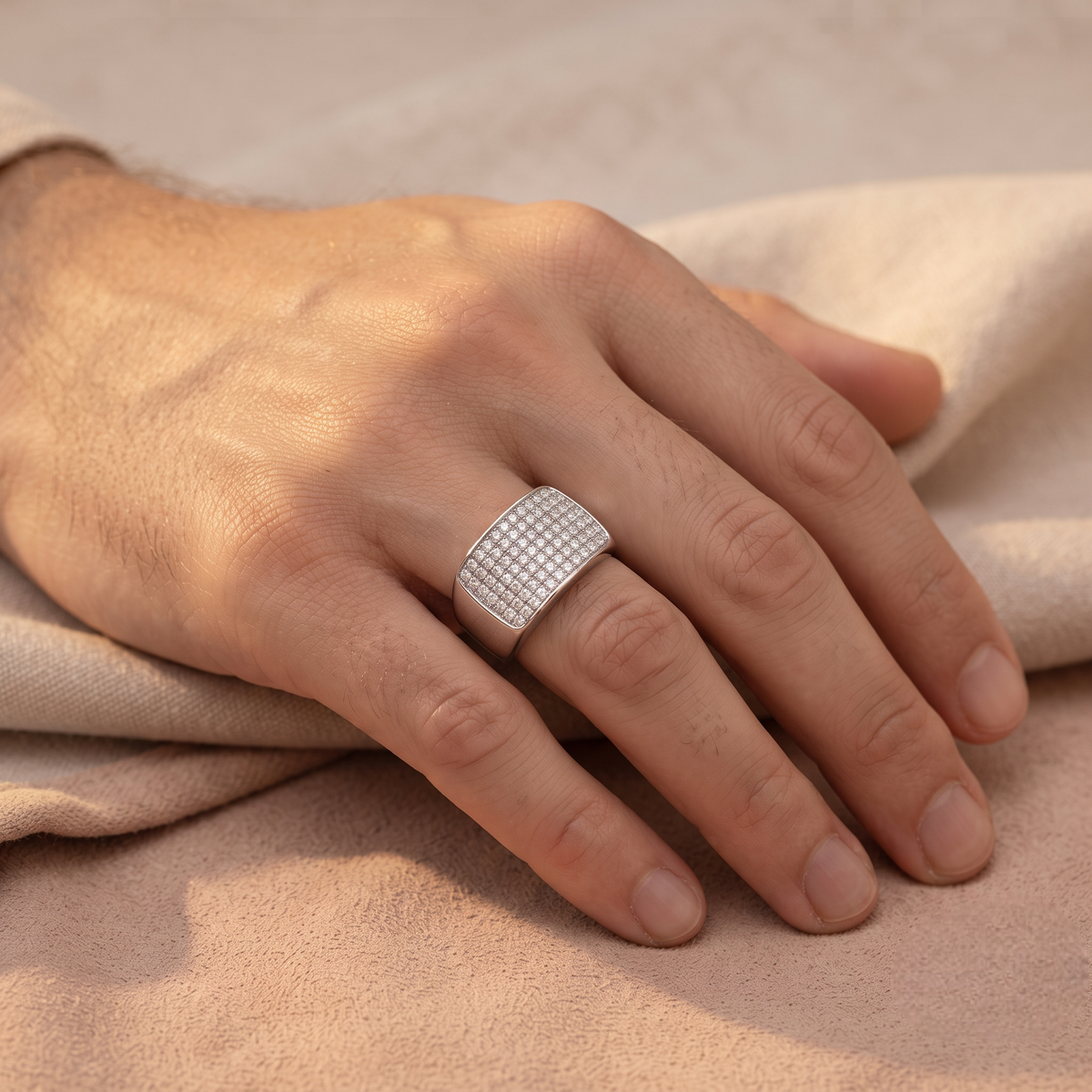 Silver ring with a broad rectangular pavé-set face and polished band.