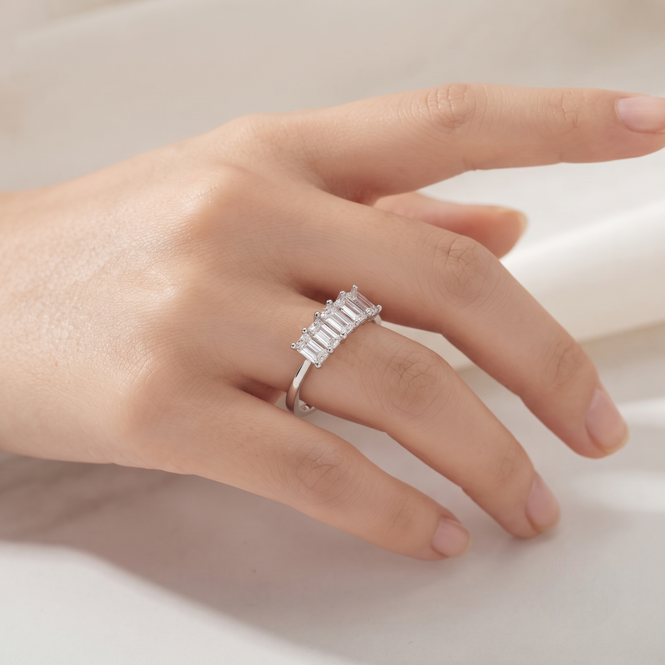 925 Sterling Silver Three-Stone Emerald Cut Cubic Zirconia Ring for Women on Black Stone Display