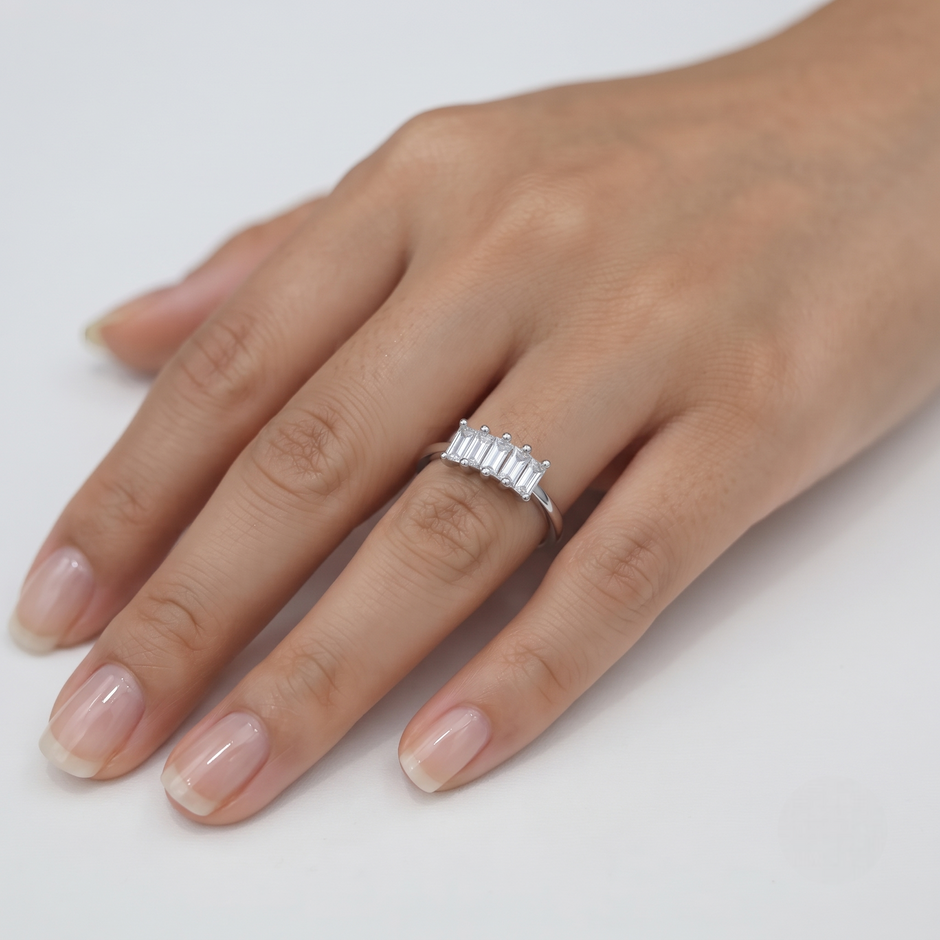 925 Sterling Silver Three-Stone Emerald Cut Cubic Zirconia Ring for Women on Black Stone Display