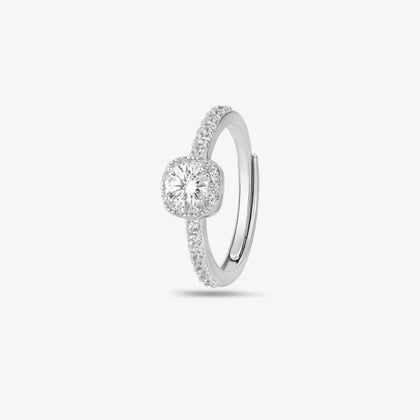 925 sterling silver halo engagement ring with a round brilliant-cut center stone and pavé band, worn on a woman's hand against a soft white background.