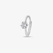 925 sterling silver solitaire ring with a round brilliant-cut stone, worn on a woman's hand against a soft white fabric background.
